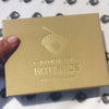 The top of the giftbox. Our Born of Botanics acorn logo is printed in gold foil. Underneath is printed 'Born of Botanics' and 'Made in Yorkshire'.