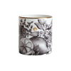 A cut out image of the Create candle in a Bone China container printed with a hand-drawn illustration of the plants used in the fragrance, including lemon, orange, and spearmint. Around the rim is a stripe of shiny 24k gold. 